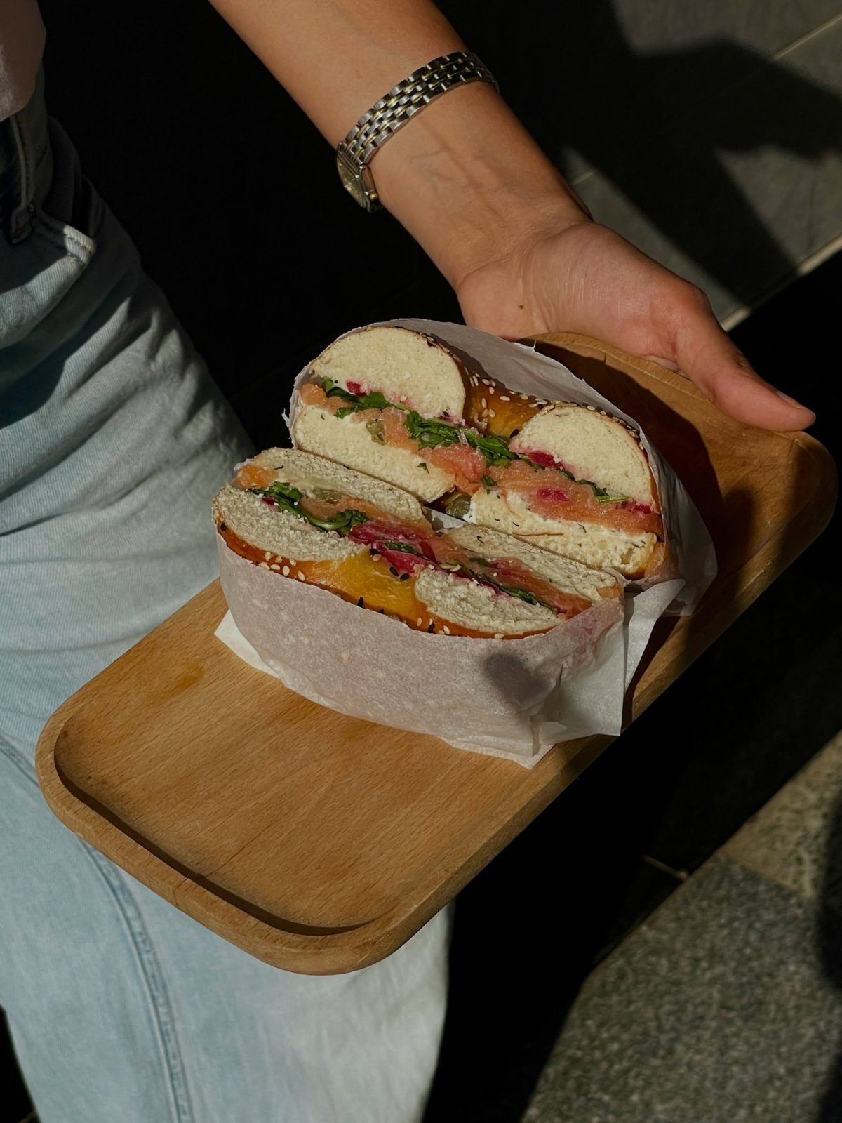 Bagel sandwich on an oak tray
