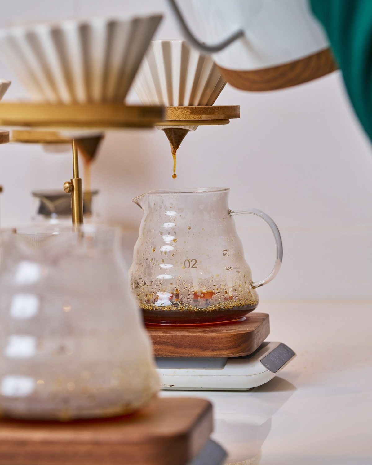 Pour-over dripper and server on an oak tray